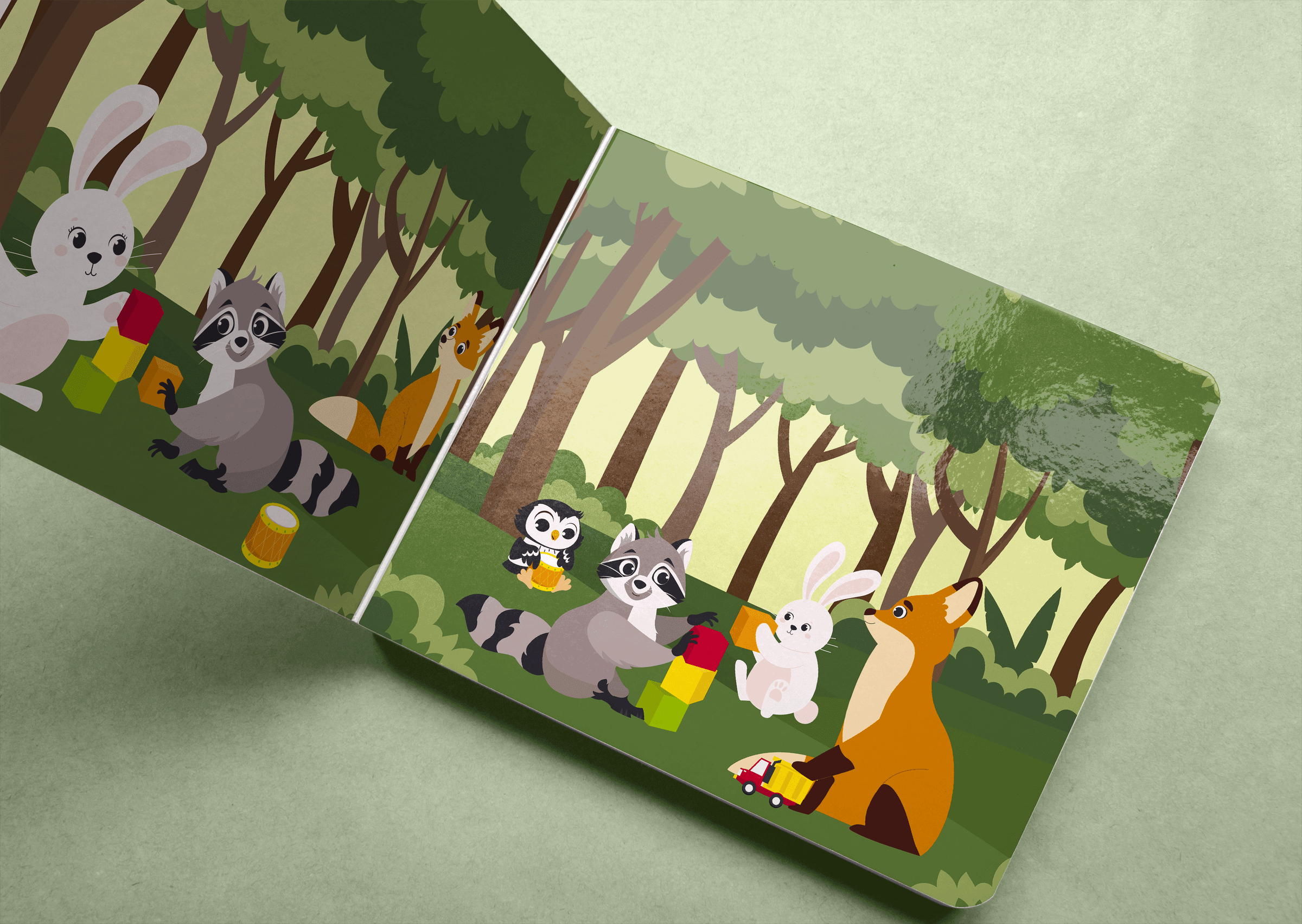 Maqueta del libro de cartón abierto, con la escena del bosque en la doble página.
